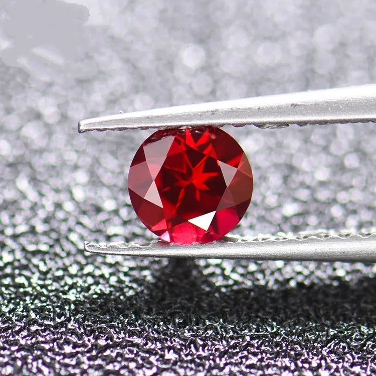 Synthetic pigeon blood red ruby gemstone showing egg shape, round, and princess square cuts