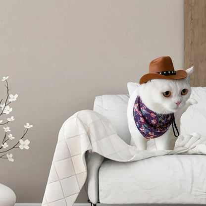 A small black cowboy hat with white stars on a non-slip surface, showing its adjustable strap.