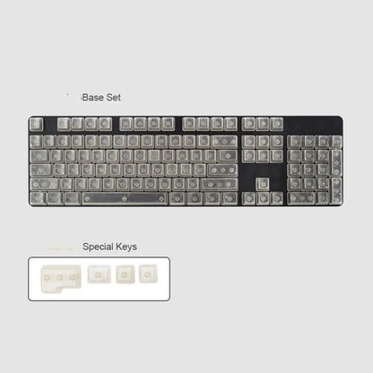 Set of 104 transparent PBT mechanical keyboard keycaps in orange, white, blue, and black colours on a black background.