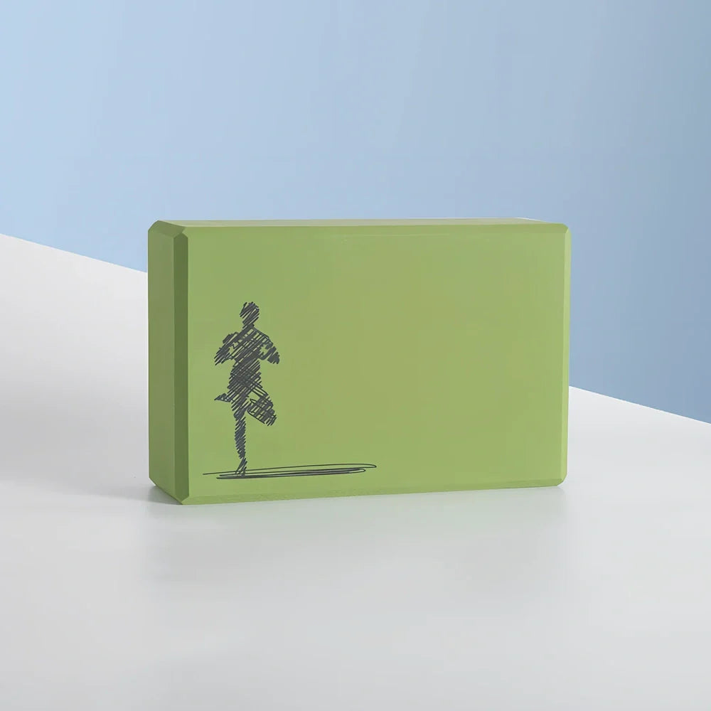 Black yoga brick with mandala pattern, 23cm long with textured surface for secure grip during yoga practice