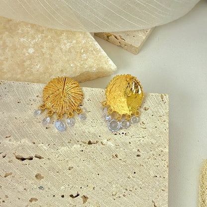 Gold geometric circle drop earrings with electroplated metal construction