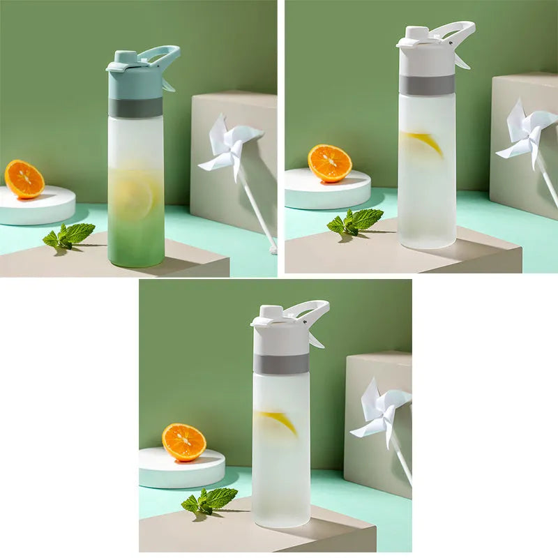 White spray water bottle with black leakproof lid and handle strap on a table