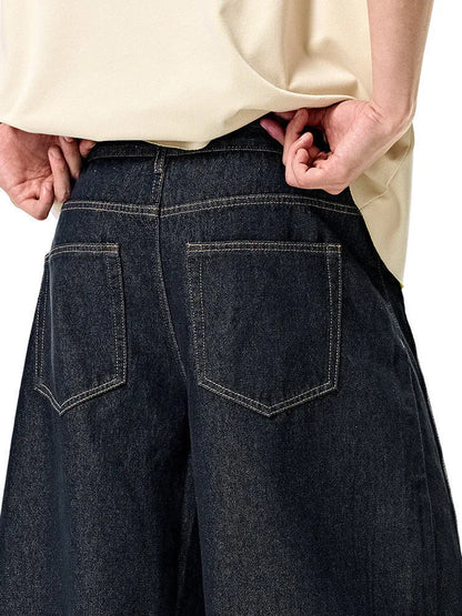 Men's wide leg denim trousers in original cow colour showing mid-waist design and relaxed fit