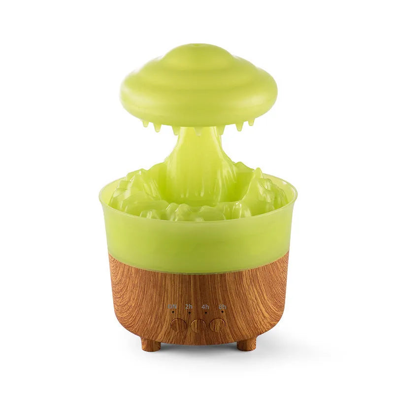 Wood grain rain cloud humidifier with LED lights and water drip feature on a table