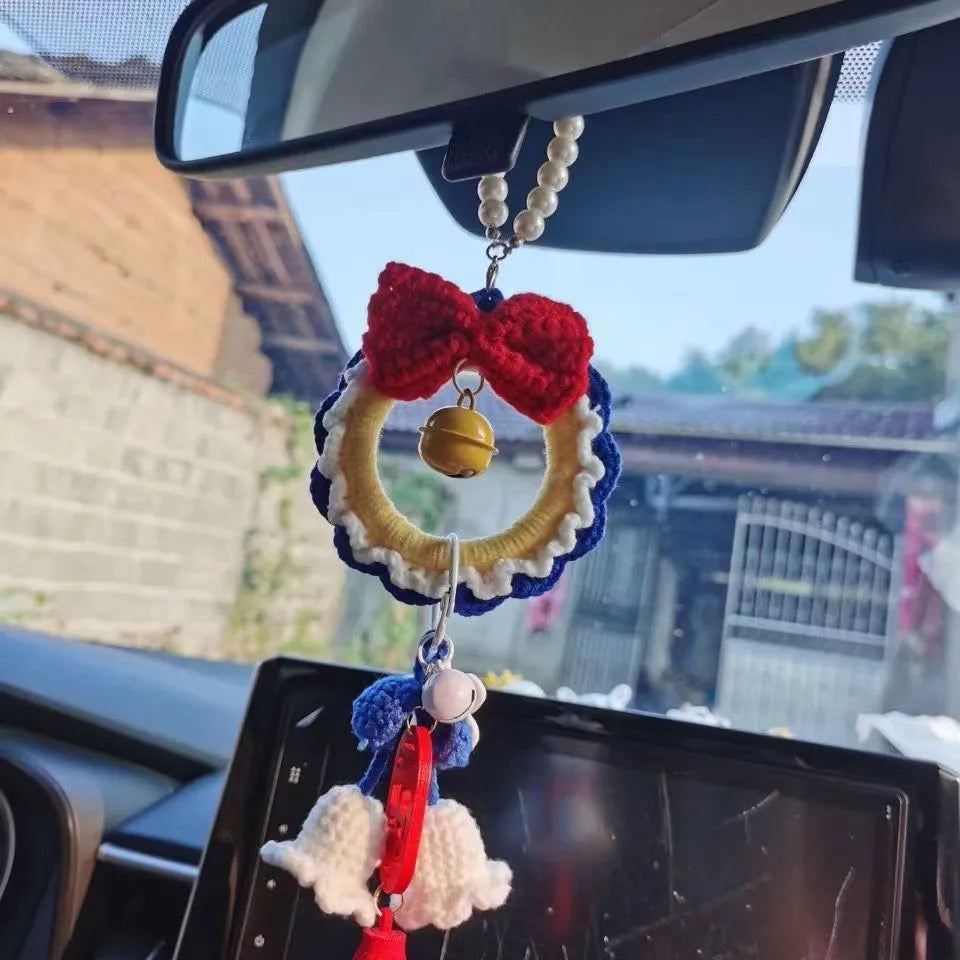 Handmade Snow White plush yarn car hanging ornament, shown as a pendant, with option for red wind chimes.