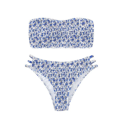 Women's strapless floral swimsuit with high-waist briefs and split back in green flower pattern.