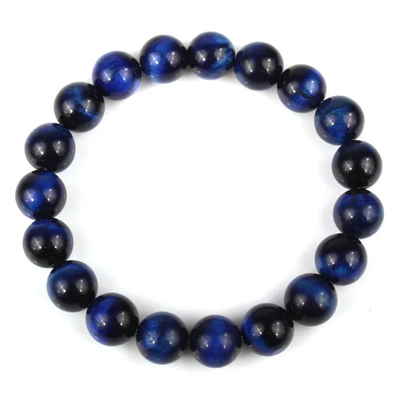 Natural tiger eye crystal bead bracelet showing round geometric beads on a wrist, available in multiple sizes and colour variations.