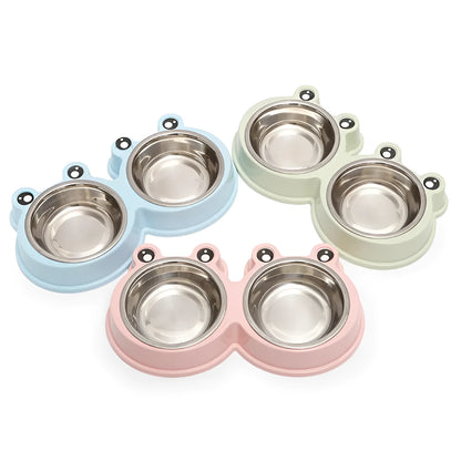 Stainless steel pet bowl with frog design and two compartments for food and water.