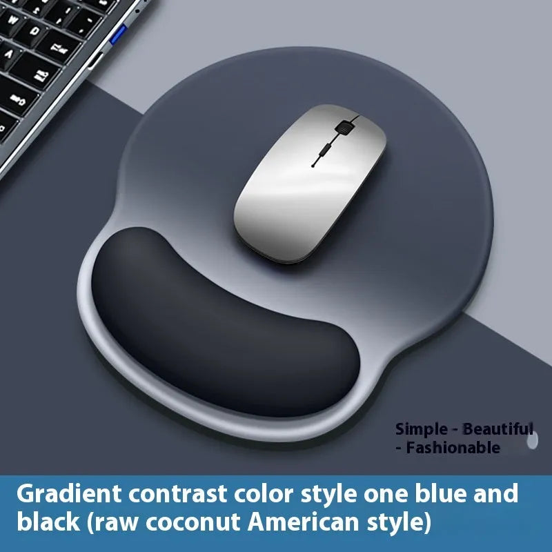Silicone mouse mat with integrated wrist rest in a gradient blue black colour on a desk.