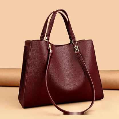 Women's messenger tote bag in horizontal square shape with crossbody strap and internal compartments