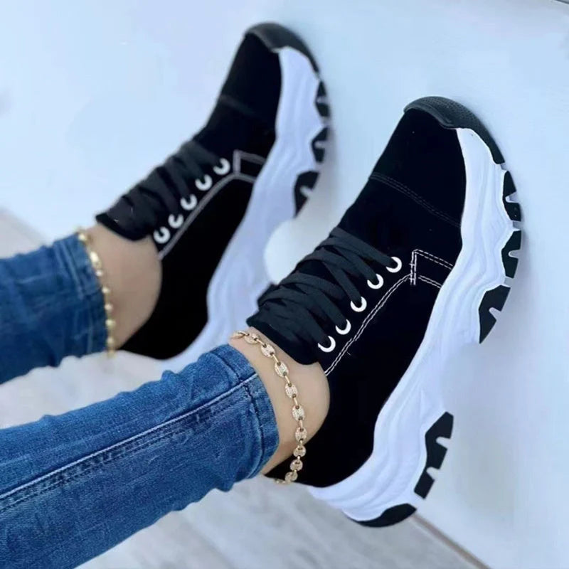 Women's platform sport flats in black, red, blue, and pink with lace-up design and thick sole