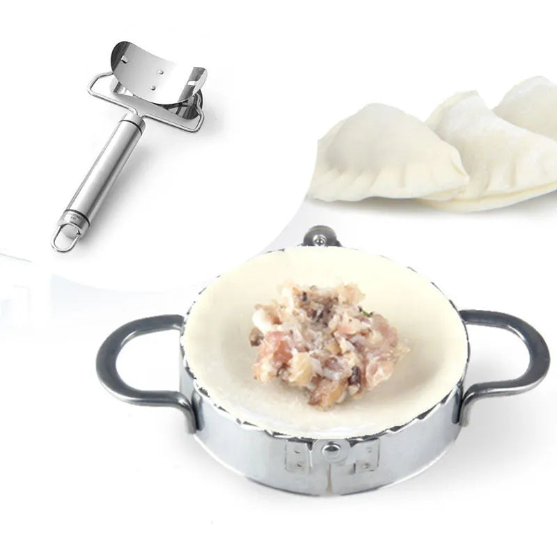 Stainless steel dumpling mould and rectangular dough cutter on a kitchen surface.