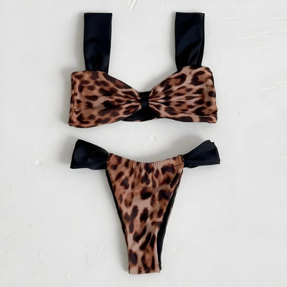 Women's black and leopard print bikini set with tube top and T-pants briefs on a mannequin.