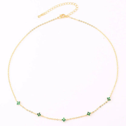 Elegant gold and silver floral necklace with adjustable chain and flower charm, perfect for vacation and beach outfits