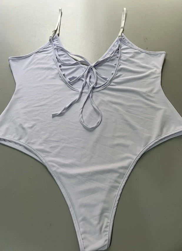 A stylish, backless one-piece swimsuit in a variety of vibrant colors for women's summer fashion.