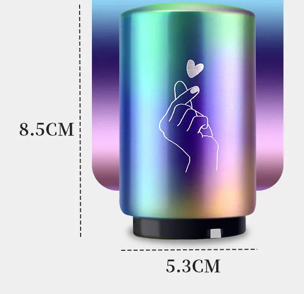 Stainless steel automatic bottle opener measuring 8.4 cm by 5.3 cm on a kitchen counter