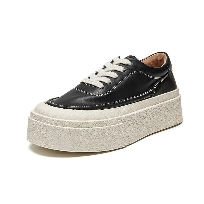 Women's black platform casual shoes with round toe and tied laces on a rubber sole.