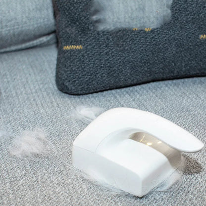 White ABS plastic reusable pet hair remover roller for cat and dog fur on fabrics.
