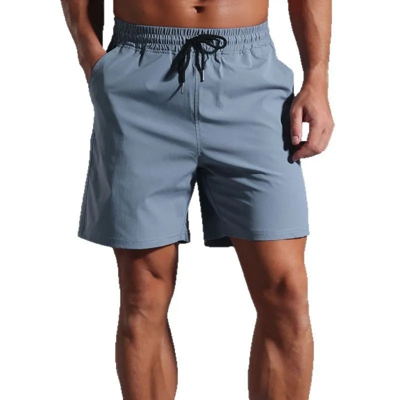 Men's loose short-length pants shorts in quick-drying polyester fibre, casual straight-leg style available in khaki, black, blue, and purplish red with mid-waist fit for men's leisure and summer wear