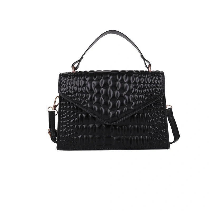 Clamshell handbag with crocodile pattern and soft handle in various colours