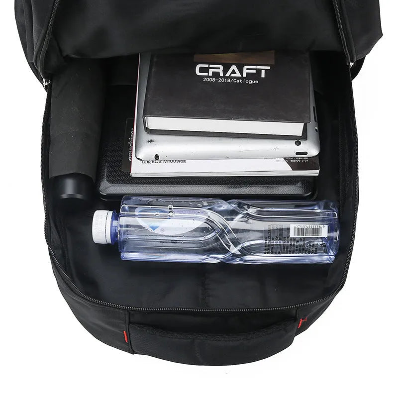 Large black nylon backpack with curved shoulder straps and letter detailing, shown from the side.