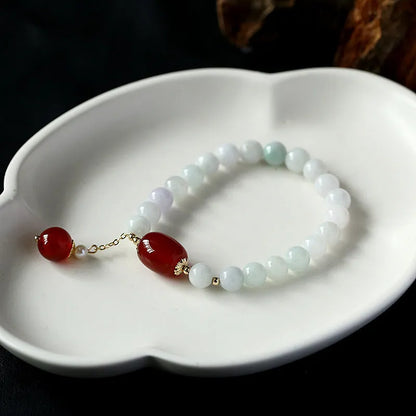 Geometric women's bracelet with hanging agate tassel and 14K gilded elements