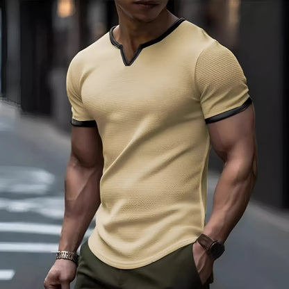 V-neck colour-block waffle texture outdoor sports T-shirt in polyester fabric on a neutral background.