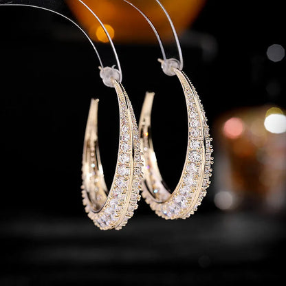 Women's geometric copper hoop earrings in gold white zirconium finish, showing 4.3 cm by 4.5 cm drop shape.