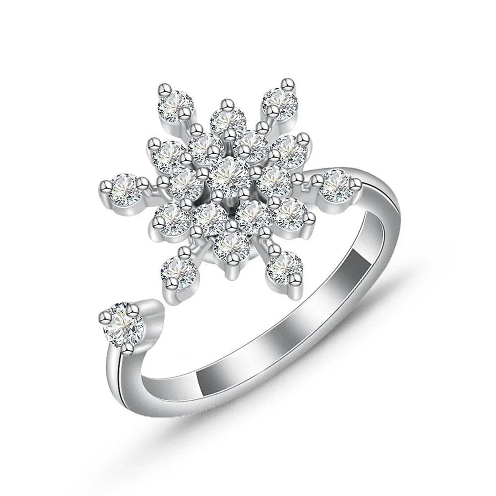 Adjustable spinner ring with rotating floral, geometric, and nature-inspired motifs for women's fashion and stress relief