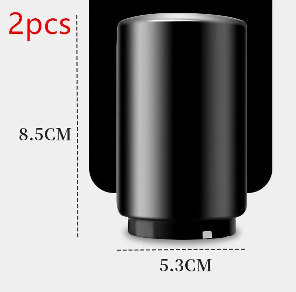 Stainless steel automatic bottle opener measuring 8.4 cm by 5.3 cm on a kitchen counter