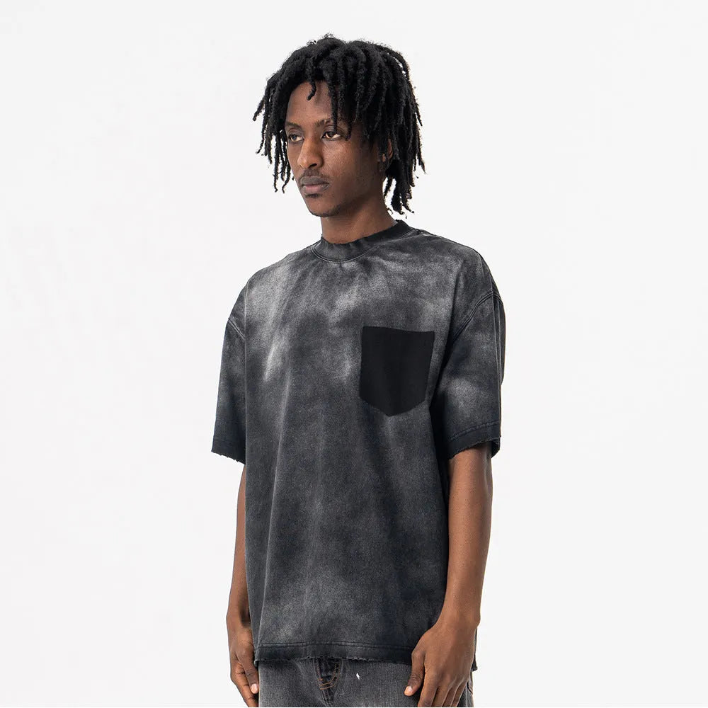 Black men's loose fit cotton t-shirt with letter print and drop-shoulder short sleeves on a hanger.