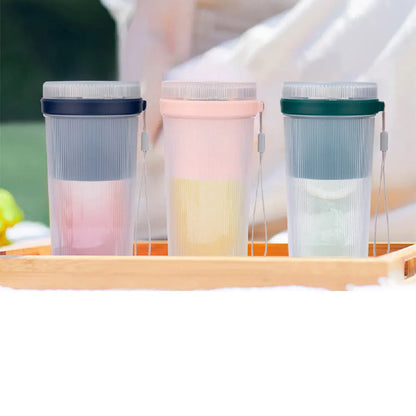 Multi-function portable blender in blue, green, or pink with USB cable and detachable parts for juicing