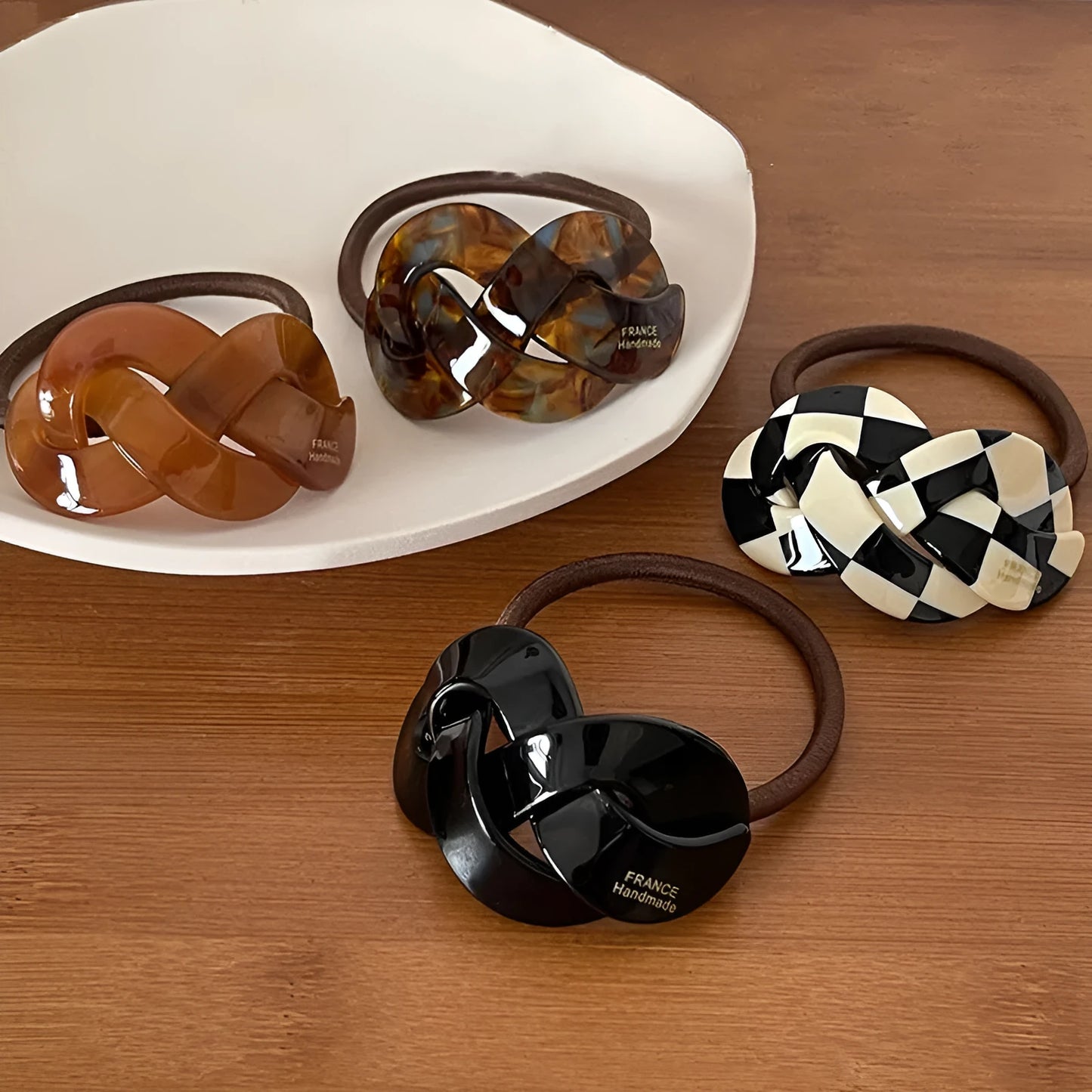 Seamless acetate hair rope ring in black, plaid, caramel, and dark coffee colours.
