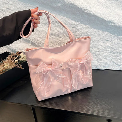 College style bow tote bag in black PU leather with double shoulder straps and bow detailing