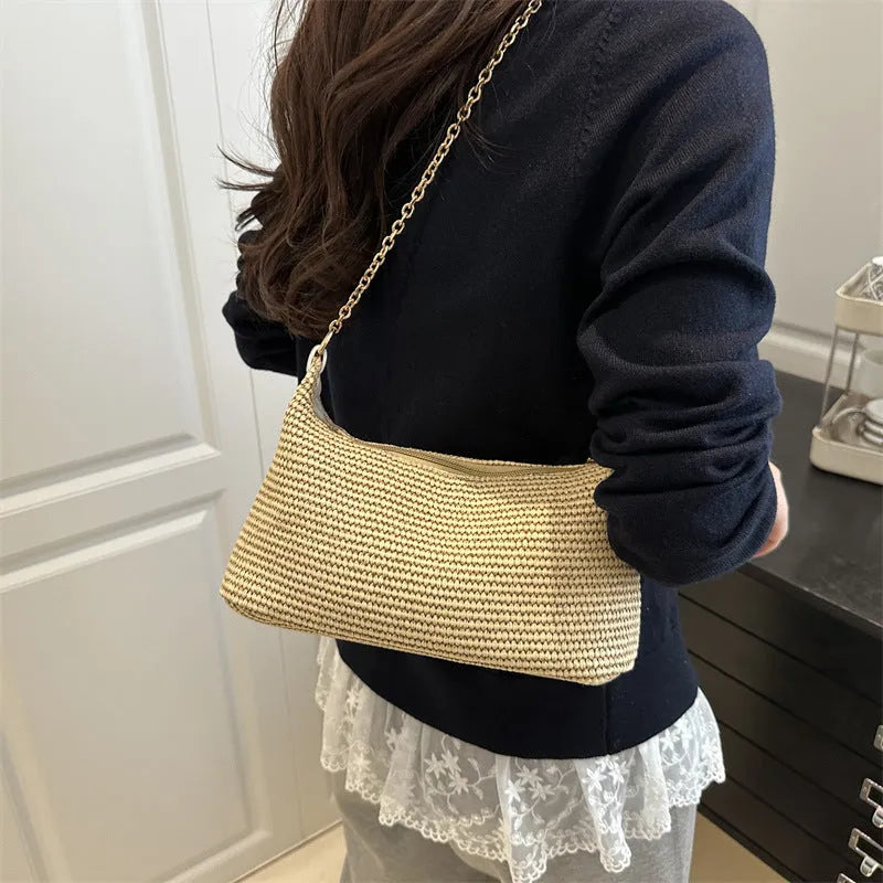 Straw woven beach tote bag with polyester lining, medium-soft texture, and horizontal square suitcase shape featuring sandwich pocket design, mobile phone compartment, and available in black, white, or khaki colours for holiday beach outings