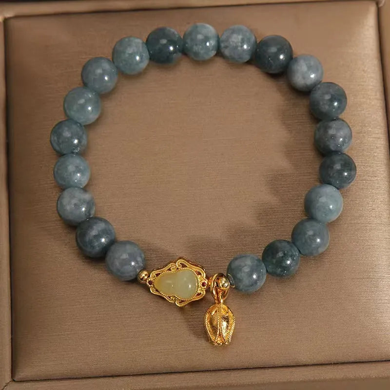 Women's natural stone bracelet with sky blue carved gourd and lotus pendant