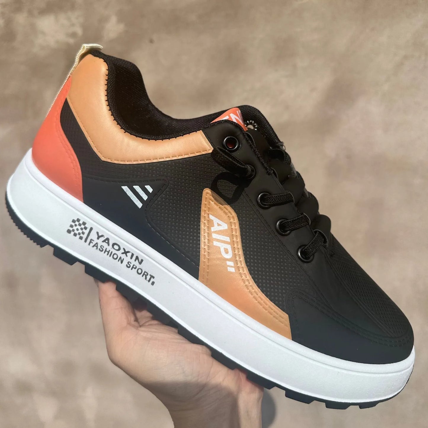 Men's casual shoes in artificial PU, shown in white-orange, white-black, and white-brown colours with a round toe.