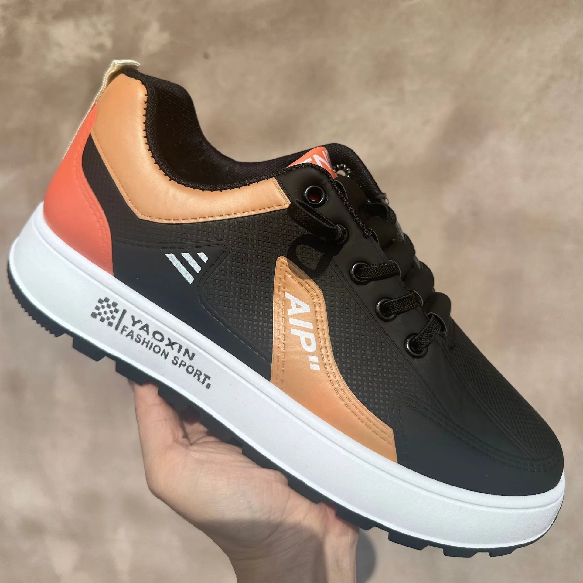 Men's casual shoes in artificial PU, shown in white-orange, white-black, and white-brown colours with a round toe.