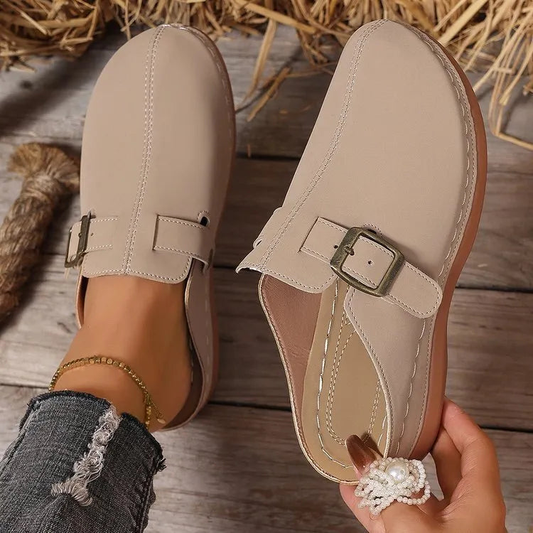 Women's casual wedge slippers in cloth with a rubber sole, shown in light brown colour.