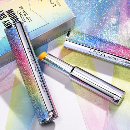 Rainbow Star colour changing lipstick tube showing honey shade transforming to pink on lips
