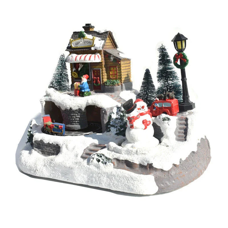 Illuminated Christmas village house with rotating Santa, Snowman, and Christmas tree decorations and playing holiday music