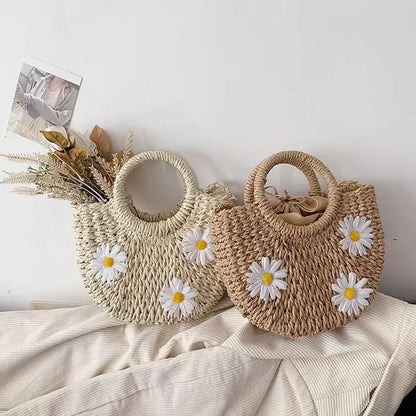 Women's light brown straw woven crossbody bag with daisy flower design showing 25x20x8 cm dimensions