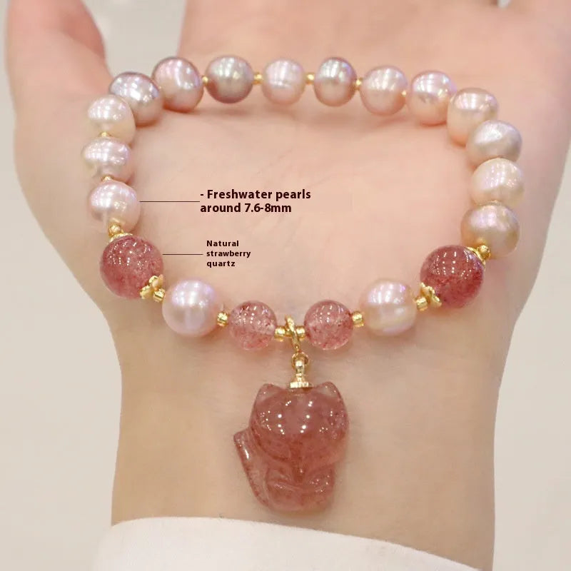 Women's light pink freshwater pearl bracelet with strawberry quartz stones and fox charm