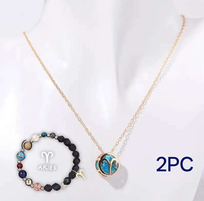 A natural stone beaded necklace and matching bracelet set laid flat, showcasing varied bead colours and textures.