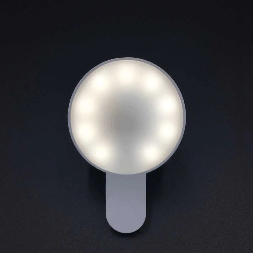 Compact white selfie fill light for mobile phones with USB cable, showing 9 LED beads and three-level dimming switch.