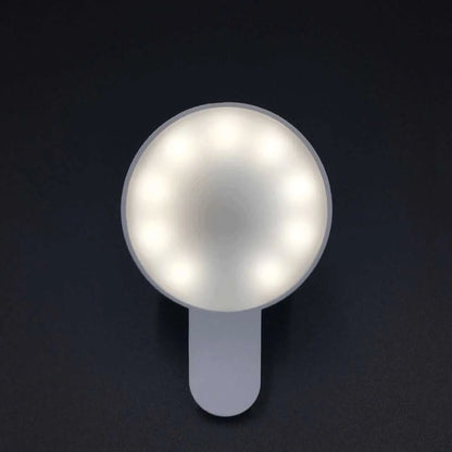 Compact white selfie fill light for mobile phones with USB cable, showing 9 LED beads and three-level dimming switch.