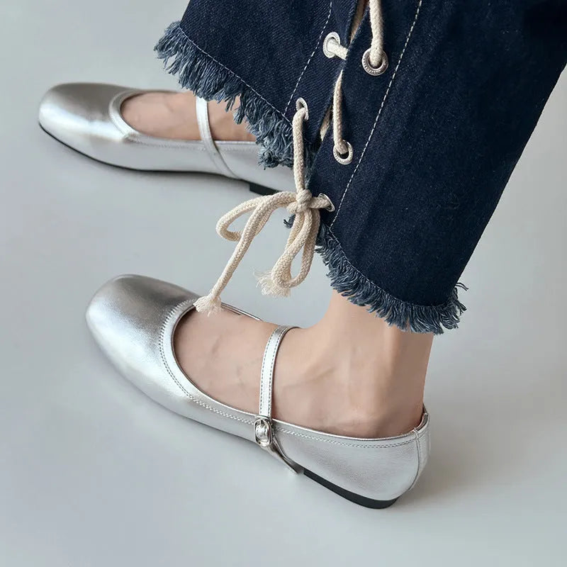 Women's sheepskin Mary Jane flat shoes in brown, showing round toe and low heel.