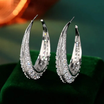 Women's geometric copper hoop earrings in gold white zirconium finish, showing 4.3 cm by 4.5 cm drop shape.