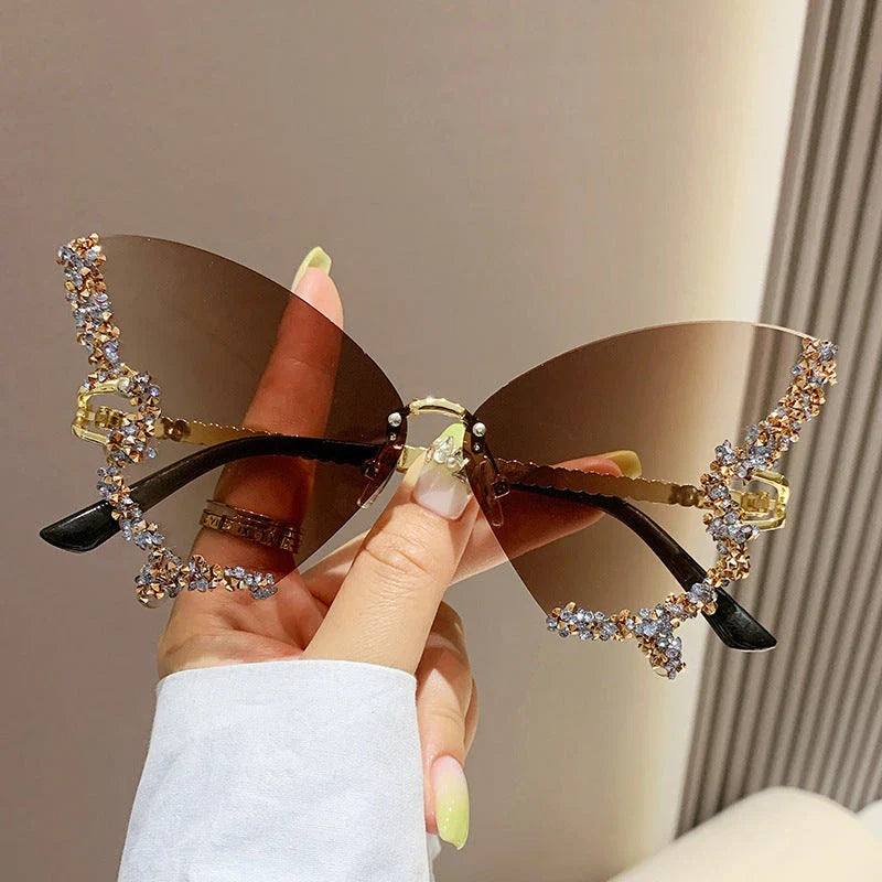 Chic butterfly-shaped sunglasses with diamond accents in various gradient color options