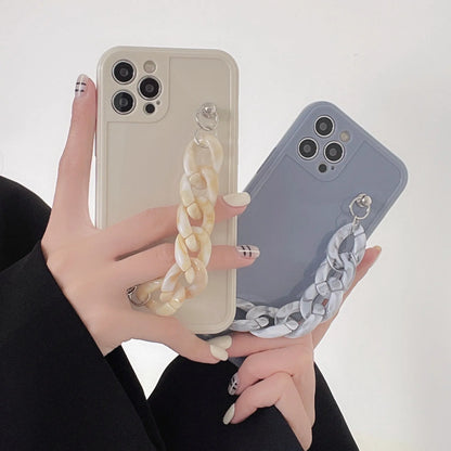 Marble pattern silicone phone case for iPhone with attached TPU bracelet, shown in grey blue colour.